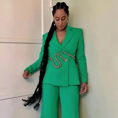 Tracee Ellis Ross in an ultra-long braided cornrows and a bright green suit
