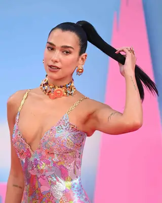 Dua Lipa wearing a sleek high ponytail