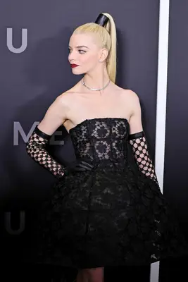 Anya Taylor-Joy wearing a sleek high ponytail with a black accessory