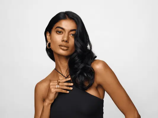 A woman with shiny, black hair that