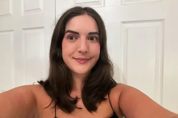 A person smiling before using the Cozy Curlers Short Cozy Curlers