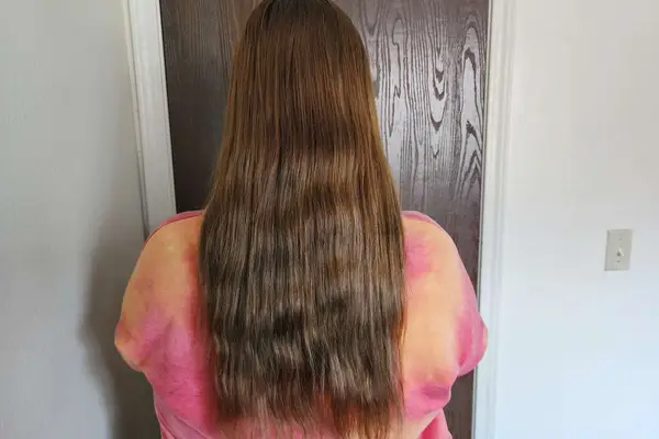 A person showing their hair before using the Mermade Hair Heatless Curls Kit