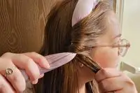A person adding the Mermade Hair Heatless Curls Kit into their hair