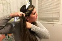 A person using the Halo Hair Labs Icy Halo Heatless Curling Kit