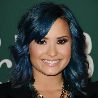 Demi Lovato with dark-blue, wavy hair