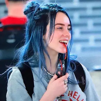 Billie Eilish with blue hair in buns