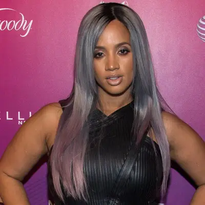Dascha Polanco with silver hair and temporary purple highlights