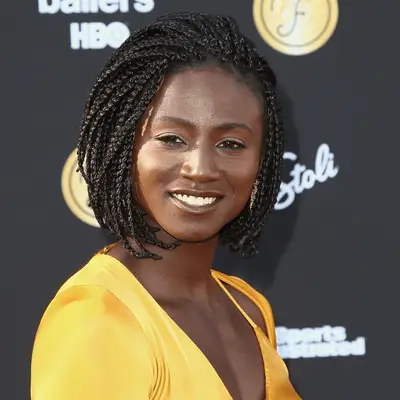 Danai Gurira with braids and frayed ends at the 2019 Vanity Fair Oscar Party in Beverly Hills, California