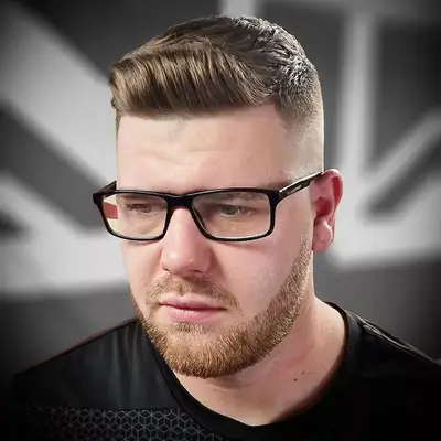 Man with blonde 1950s-inspired quiff hairstyle