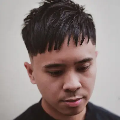 Man with straight fringe haircut