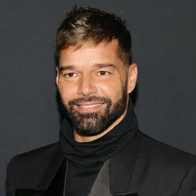 Ricky Martin wears a Caesar haircut with a faux-hawk effect