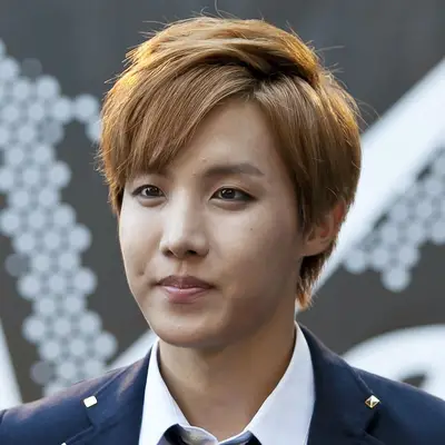 J-Hope wears a parted Caesar fringe haircut