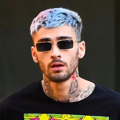 Zayn Malik wears a blue fringe haircut and sunglasses
