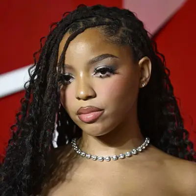 Chloe Bailey with side-swept locs at the 2024 Fashion Awards in London, England