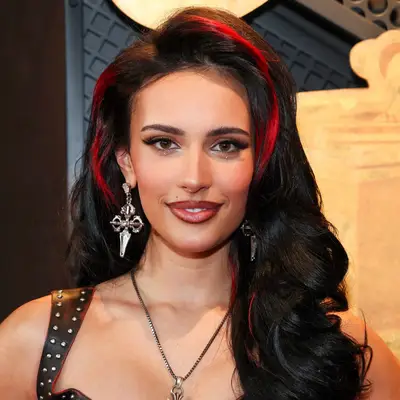 Kylie Cantrall with red side-parted money pieces at the 2025 Grammy Awards in Los Angeles