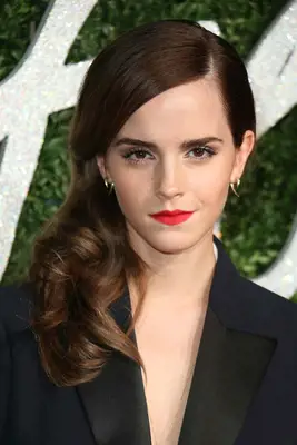Emma Watson with slicked down sid-swept hair on the red carpet