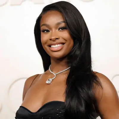 Coco Jones with sleek side-swept hair at the 2025 Oscars in Hollywood, California
