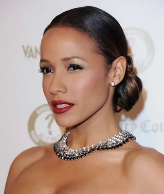 Dania Ramirez with a side-swept one-sided bun on the red carpet