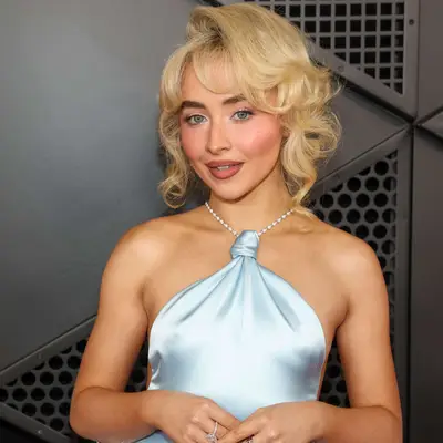 Sabrina Carpenter with retro side-swept curls in an updo at the 2025 Grammy Awards in Los Angeles