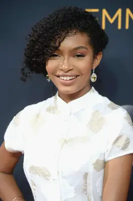 Yara Shahidi with curly side-swept hair