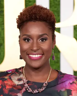 Issa Rae with a natural curly pixie