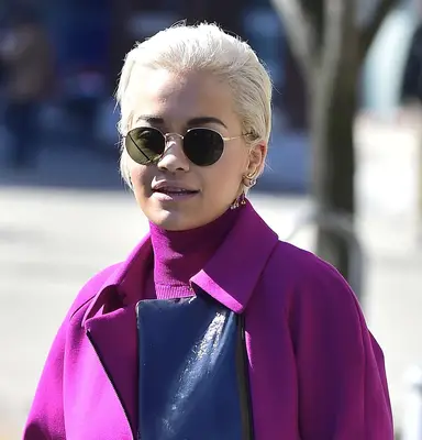 Rita Ora with a Long and slicked-back wet-look Pixie Cut