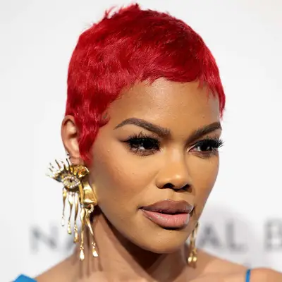 Teyana Taylor with vibrant red pixie cut attends the National Board Of Review 2024 Awards Gala