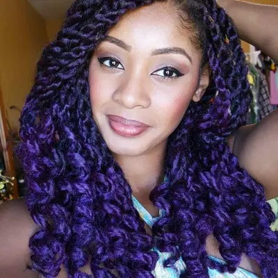 A woman with two toned Marley twists, purple and black