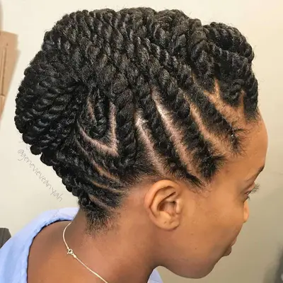 Close up of a woman with a twisted updo of Marley twists