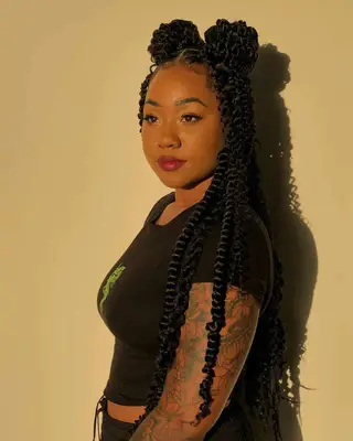 Woman with Marley twist space buns