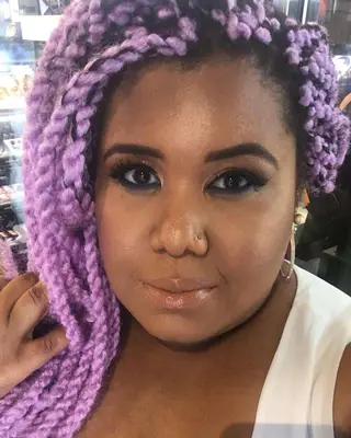 A woman with lavender Marley twists
