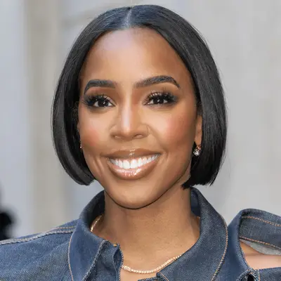 woman with platinum blonde hair in middle part, shaggy cut with bangs