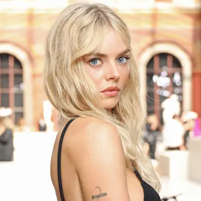 Halle Berry smiling at camera with chin length hair curled and in side part