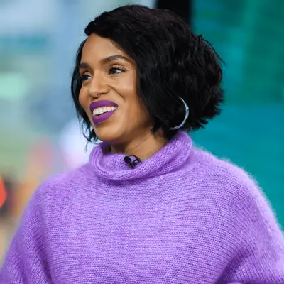 Emma Chamberlain looking at camera with short chin length blonde hair in blended bob style