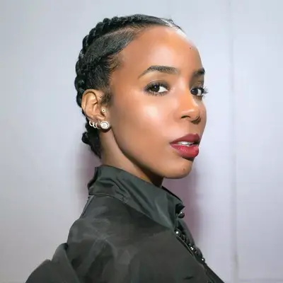 Kelly Rowland wears a short cornrowed ballerina bun hairstyle