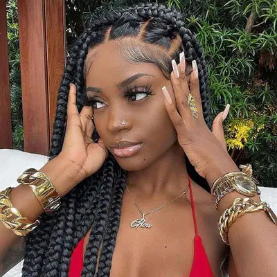 Woman wears a jumbo box braid hairstyle
