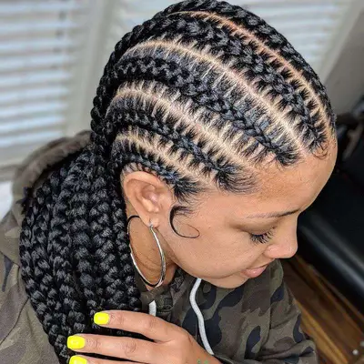 Woman wears a stitch braided hairstyle