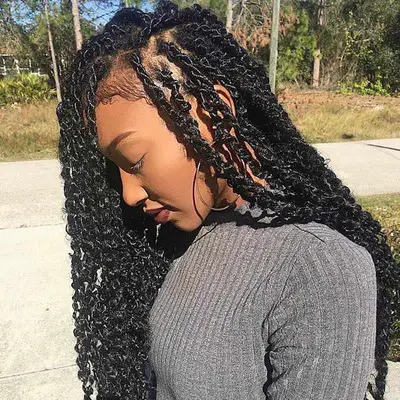 Woman wears long passion twists hairstyle