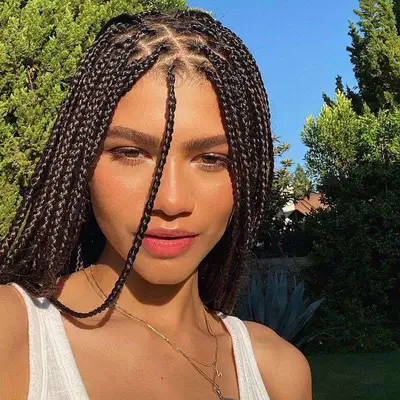 Zendaya wears a knotless braid transition hairstyle