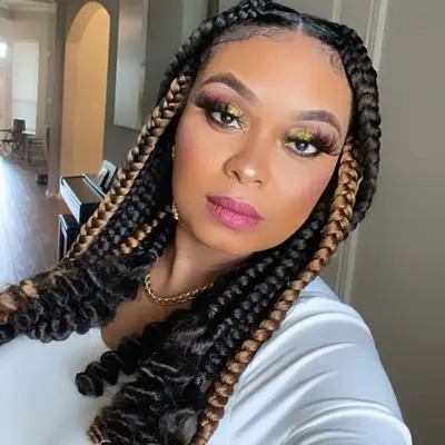 Celma Ribas wears unraveled braided hairstyle and colorful makeup