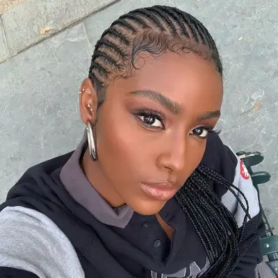 Justine Skye wears a cornrow hairstyle