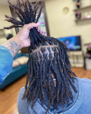  A person with interlocked locs