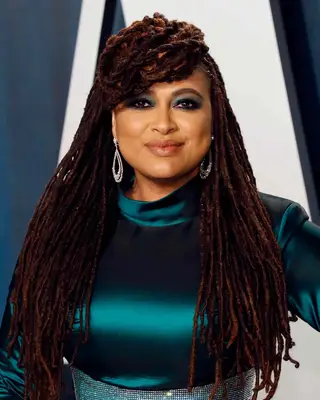 Ava Duvernay wearing long locs with a front bun