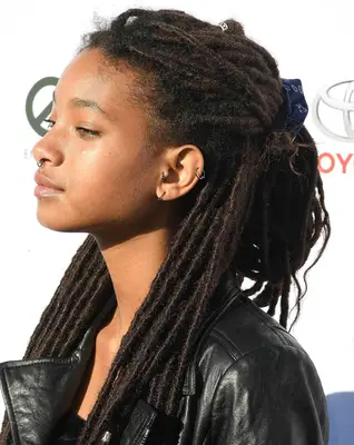 Willow Smith wearing long locs in a half-up style at the 2017 EMA Awards in Santa Monica, California