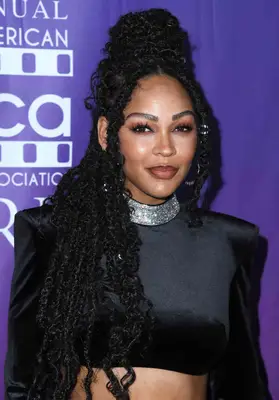 Megan Goode wearing goddess locs in a half-bun, half-down style at the 2022 AAFCA Film Honors event in Los Angeles, California