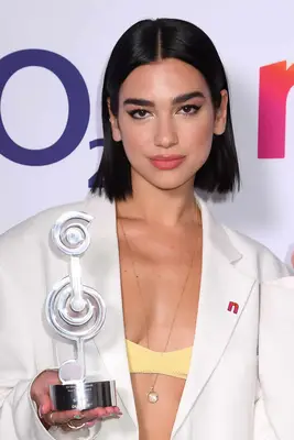 Dua Lipa with a middle-parted bob