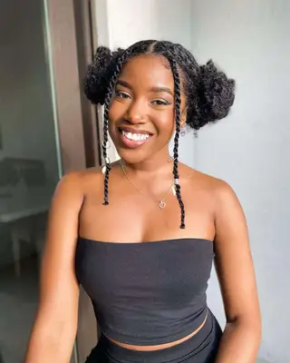 Space buns with face-framing braided tendrils