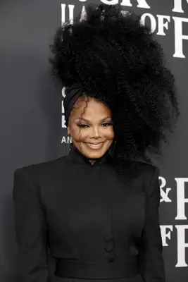 Janet Jackson wearing a large afro side ponytail
