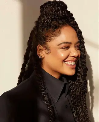 Close up of Tessa Thompson with twisted hair
