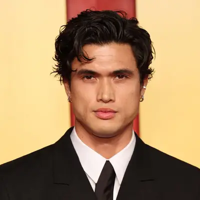 Charles Melton with short, textured hair at the 2024 Vanity Fair Oscar Party